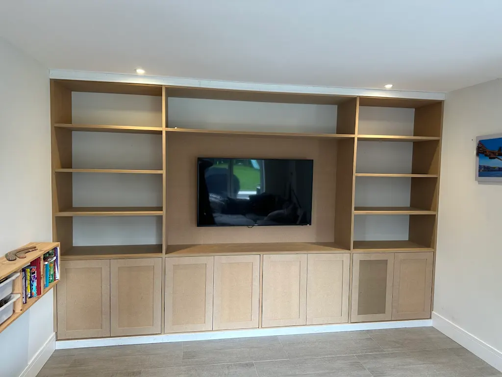 Full-wall built-in TV unit and shelving