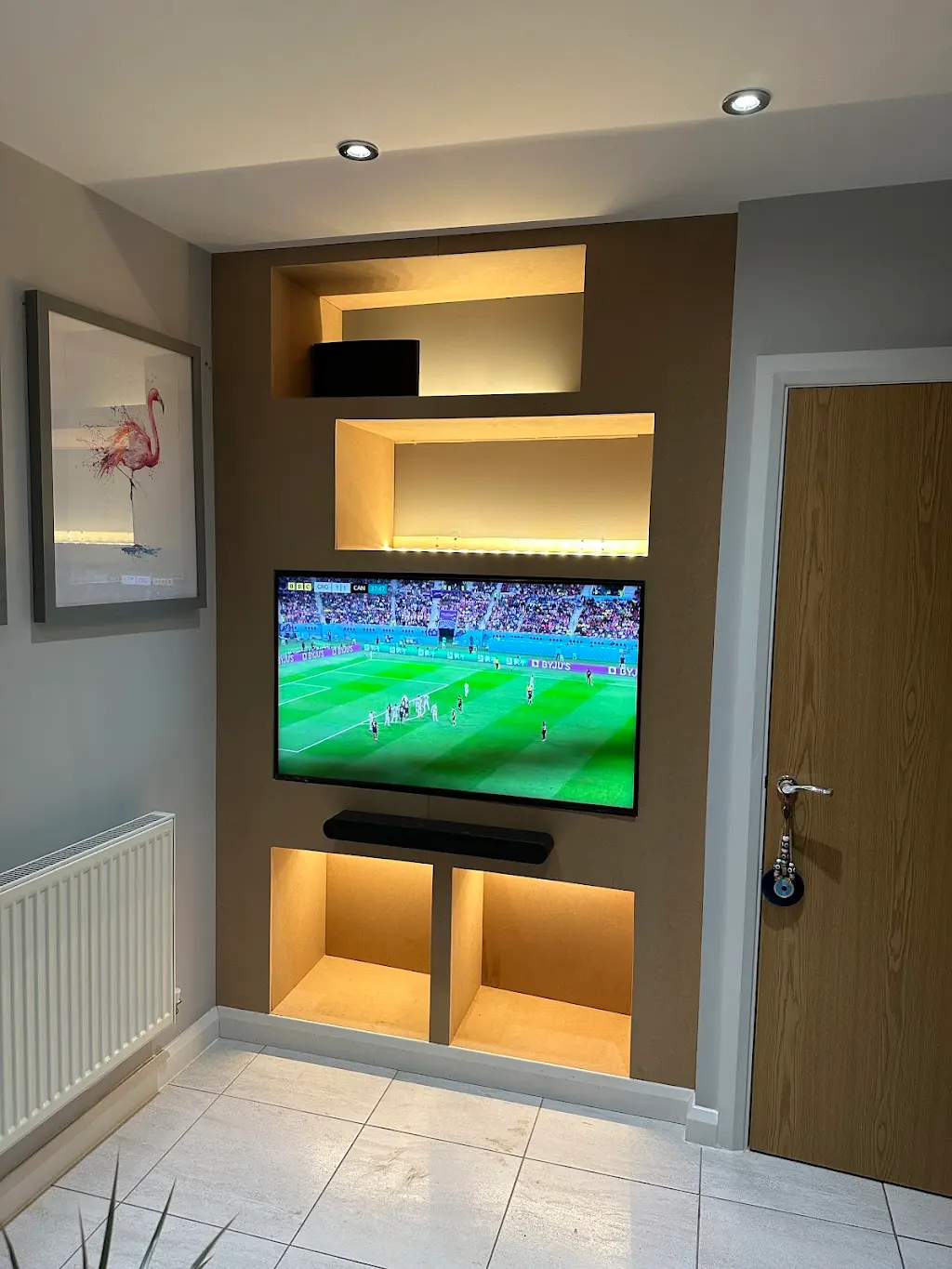 Backlit media wall with bespoke alcoves